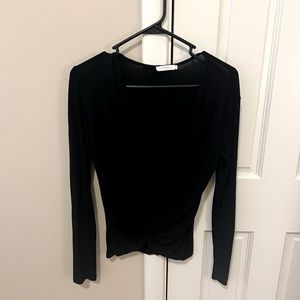 Lush brand cross front, long sleeve shirt, free beauty gift with purchase.